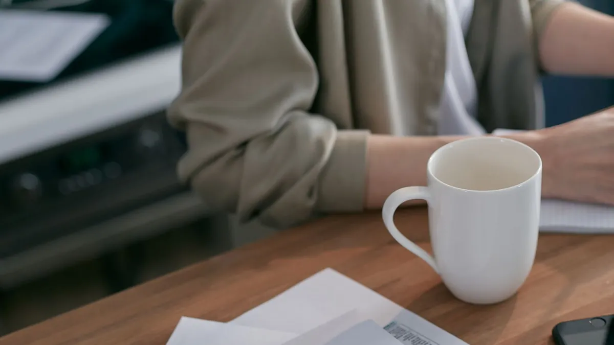 Income tax forms beside white envelopes on a wooden table